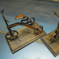 Tricycles on wooden base